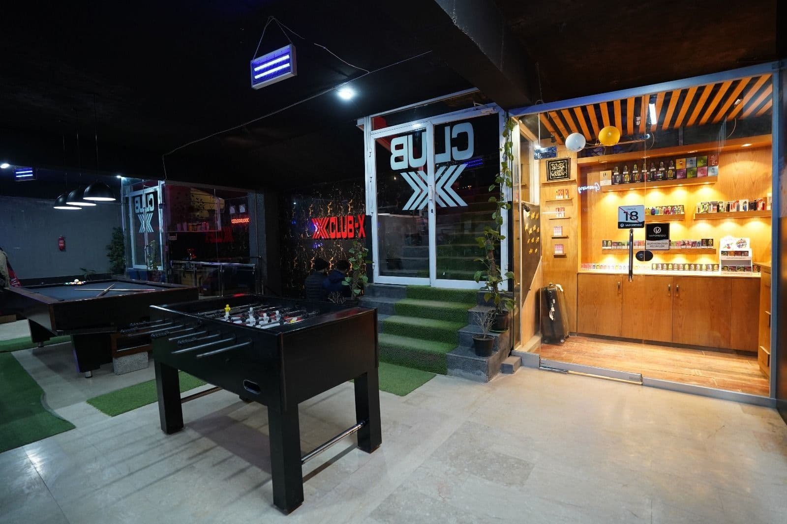 Inside Club X — the lounge, entrance and shop at U Tower